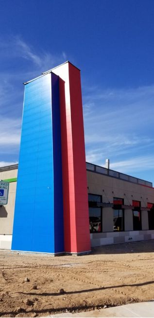 Cladding installation using bright colors and aesthetically pleasing design.