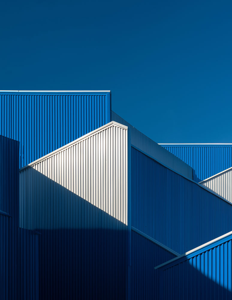 Multiple buildings with multicolor exterior cladding.